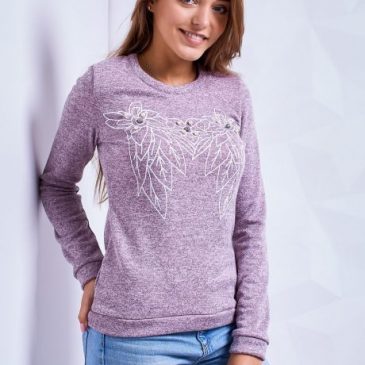 Autumn women’s sweaters in the wardrobe of the woman of fashion.